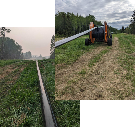 Above ground surface bypass pipeline with large flexible hose reel deployed across a grassy field by Prima Pipe Solutions
